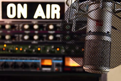 Microphone and sign that reads "On Air"