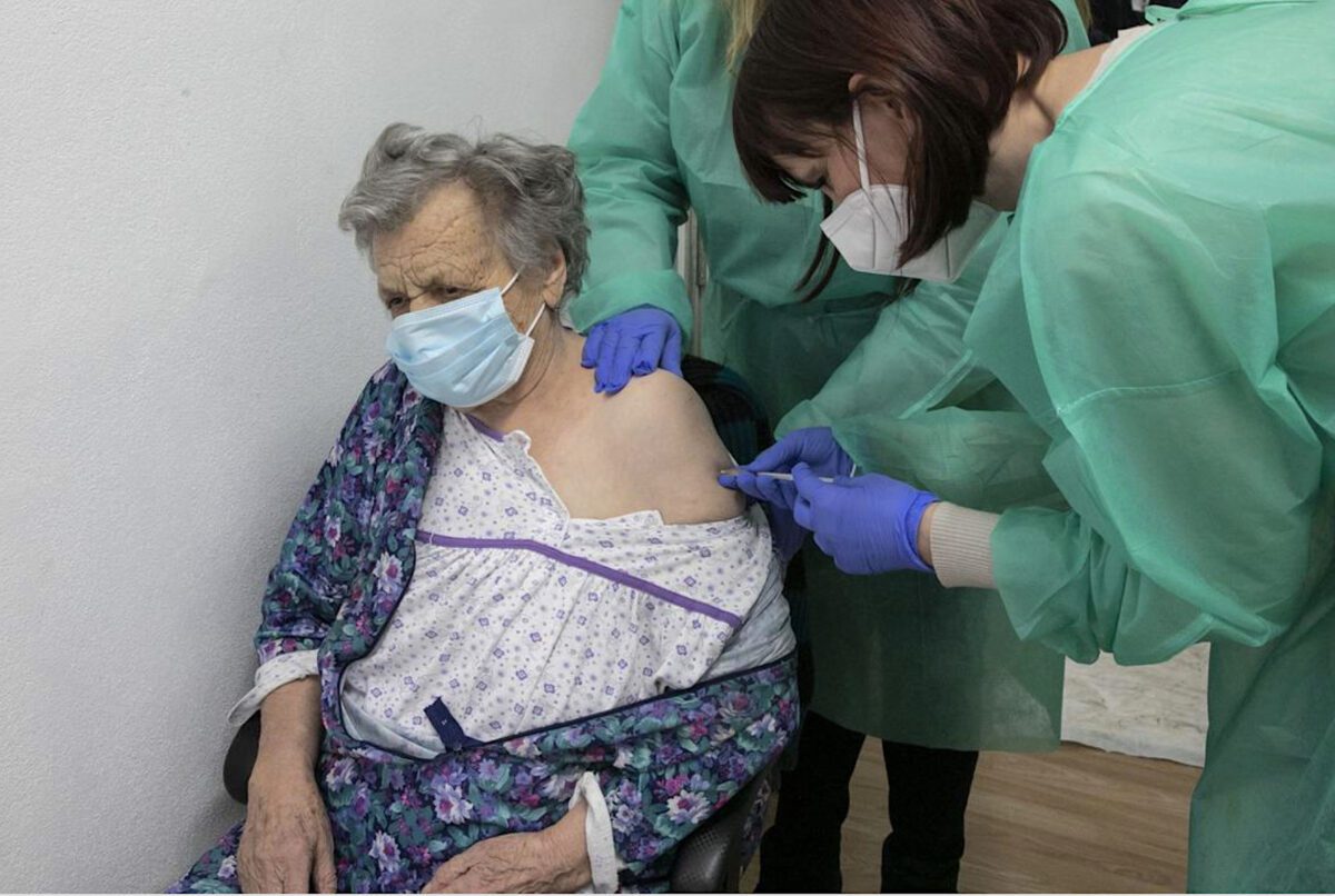 Older woman getting a vaccine