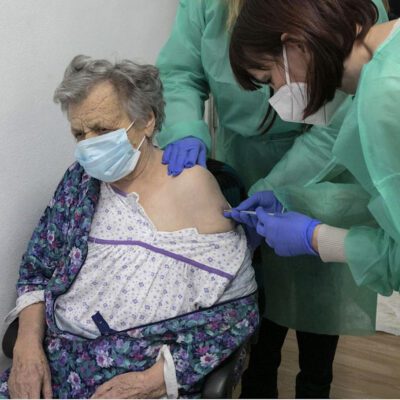 Older woman getting vaccinated