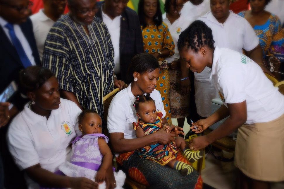 Young children getting a malaria vaccine in Ghana