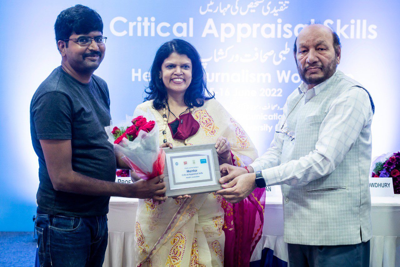Muralik is honored with a certificate