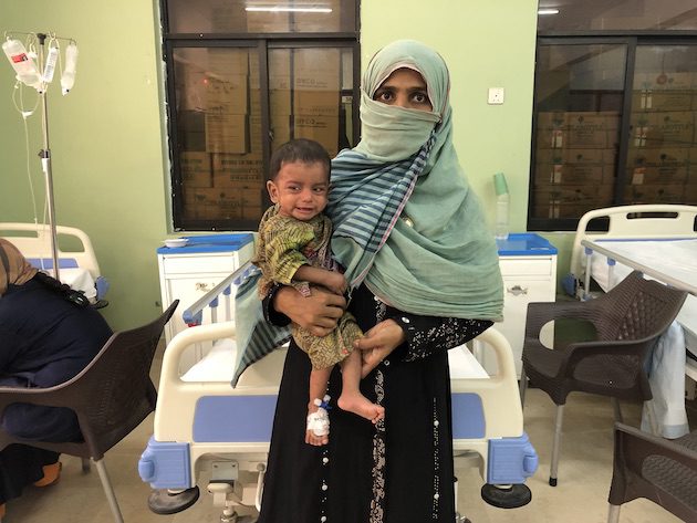 Mom with her child who is sick with typhoid